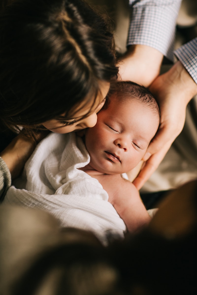 Newborn Photographer, little girl kissing baby on cheek