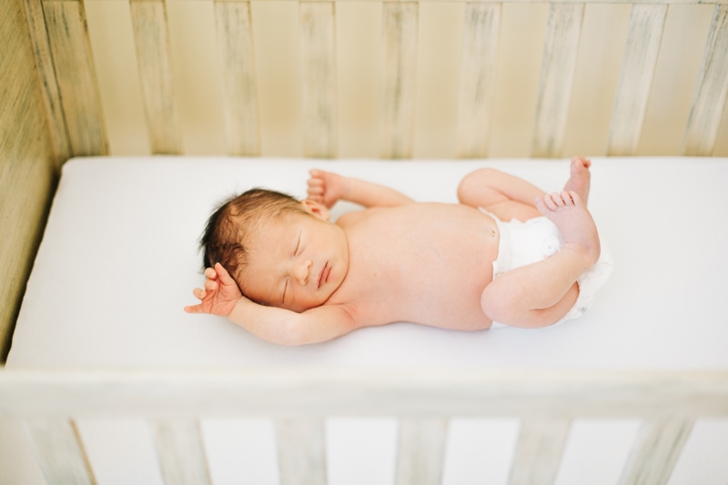 Newborn Photographer, baby asleep in white linen crib