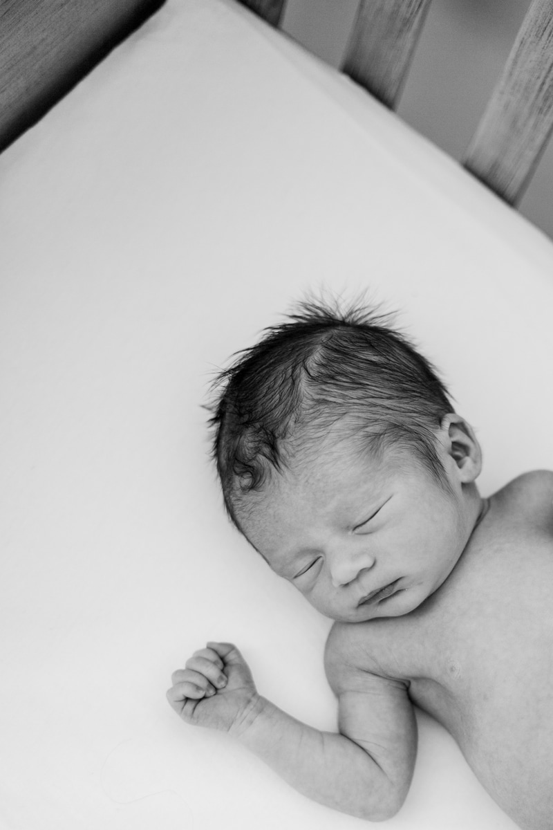 Newborn Photographer, black and white image of baby sleeping